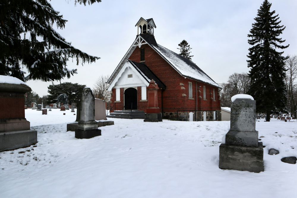 Gravestones stand near church. Gravestones stand near church.
