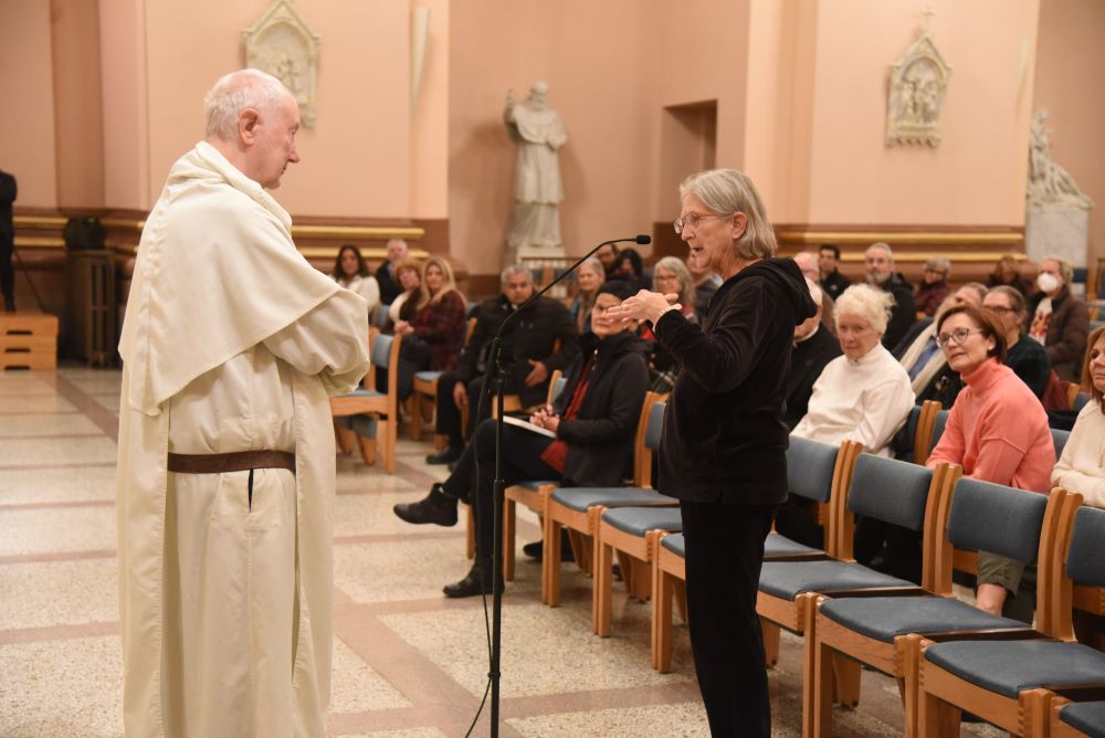 Lucy Robie, a member of St. Thomas the Apostle Parish in Fortville, Indiana, asks a question of Dominican Fr. Timothy Radcliffe at Sts. Peter and Paul Cathedral in Indianapolis Dec. 6, 2023, after the priest gave a presentation on the synod on synodality as part of a tour of U.S. cities. Lucy Robie, a member of St. Thomas the Apostle Parish in Fortville, Indiana, asks a question of Dominican Fr. Timothy Radcliffe at Sts. Peter and Paul Cathedral in Indianapolis Dec. 6, 2023, after the priest gave a presentation on the synod on synodality as part of a tour of U.S. cities.