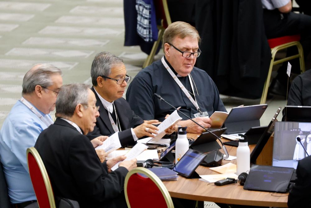 Cardinal Joseph Tobin of Newark, New Jersey, (right) prays before a working session of the Synod of Bishops at the Vatican Oct. 26, 2023. Cardinal Joseph Tobin of Newark, New Jersey, (right) prays before a working session of the Synod of Bishops at the Vatican Oct. 26, 2023.