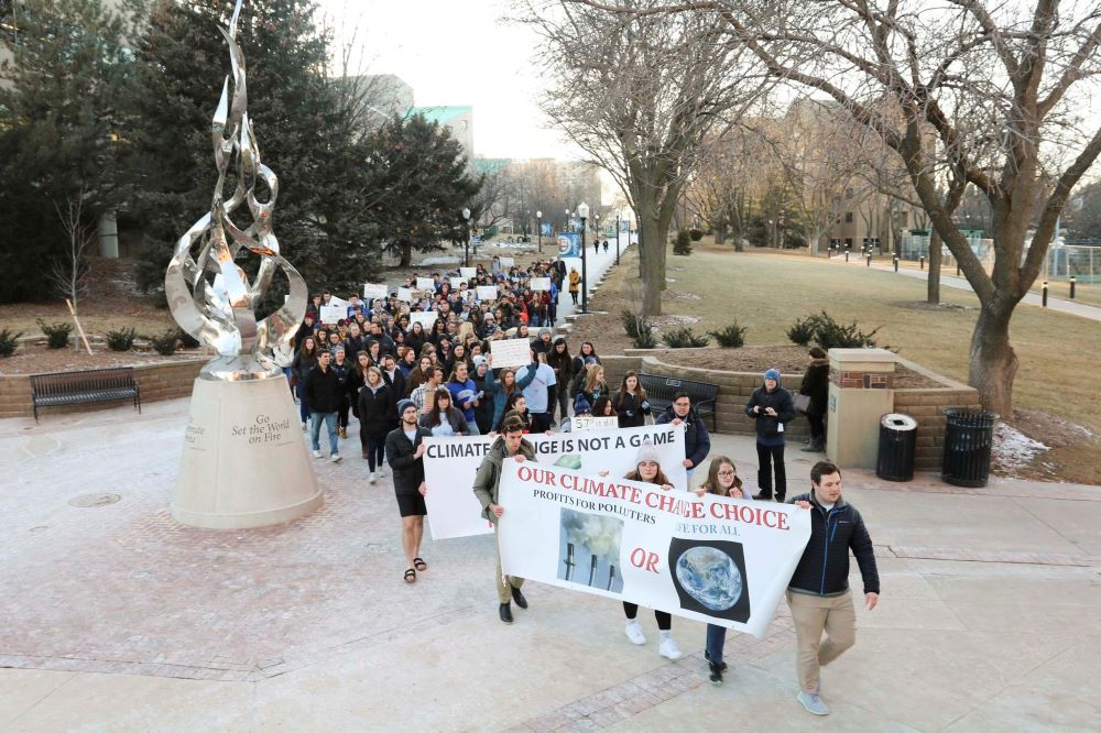 People rally at Creighton University in Omaha, Nebraska, Feb. 20, 2020, calling for the Jesuit-run school to fully divest from fossil fuels. People rally at Creighton University in Omaha, Nebraska, Feb. 20, 2020, calling for the Jesuit-run school to fully divest from fossil fuels.
