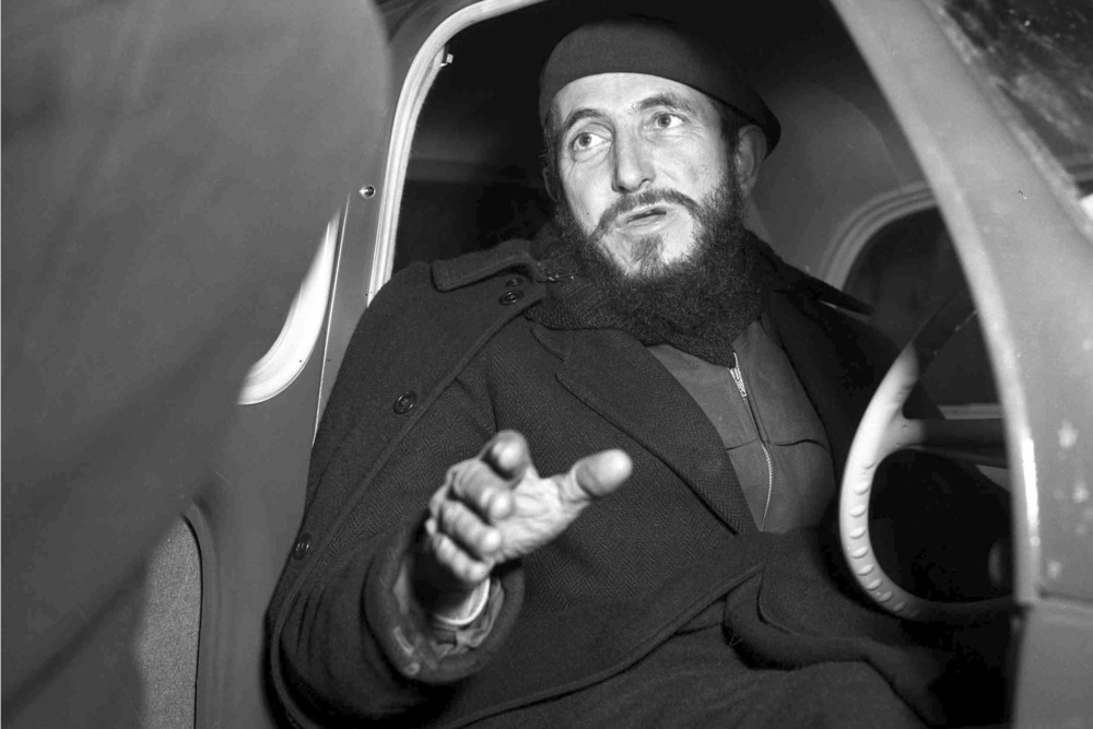 Abbie Pierre, 1954. Pierre, shown in black and white photo, gets into car.