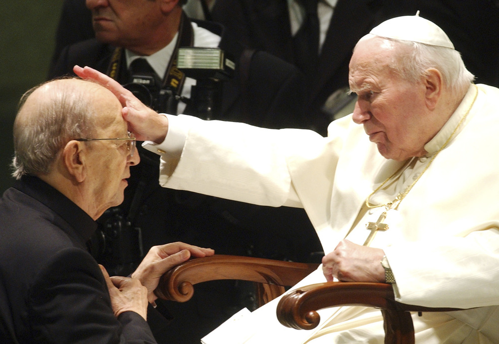 John Paul II blessing Fr. Marcial Maciel, 2004. Elderly John Paul II, seated, lays hands on Fr. Maciel's forehead, as he kneels for blessing.
