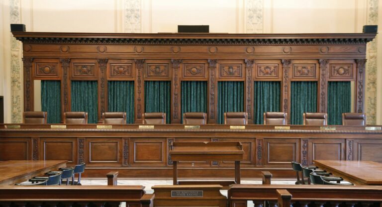 Oklahoma Supreme Court Paneled interior of courtroom.