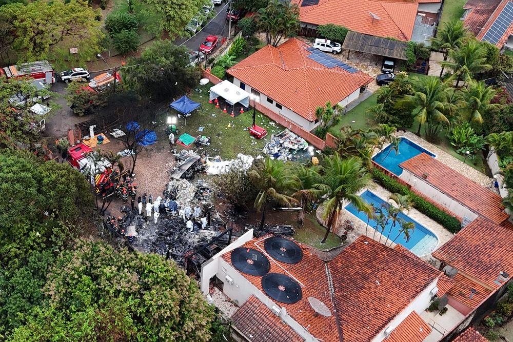 Plane crash Sao Paulo, Brazil, 2024. Aerial view of smoldering wreckage in middle of residential area.