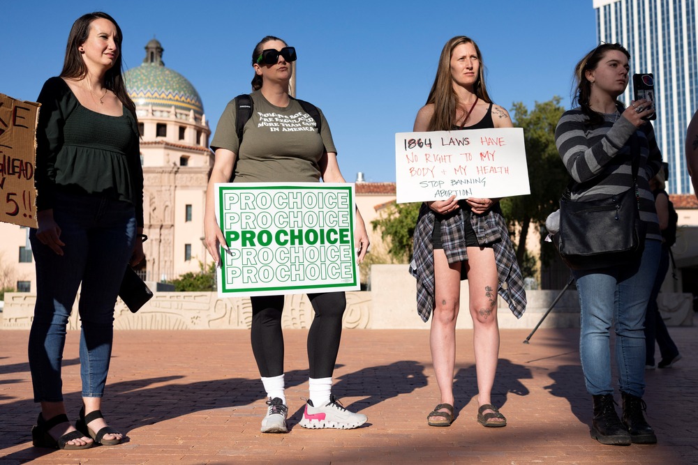 Pro-choice rally Tucson, Arizona, April 9, 2024. Four women stand holding signs.