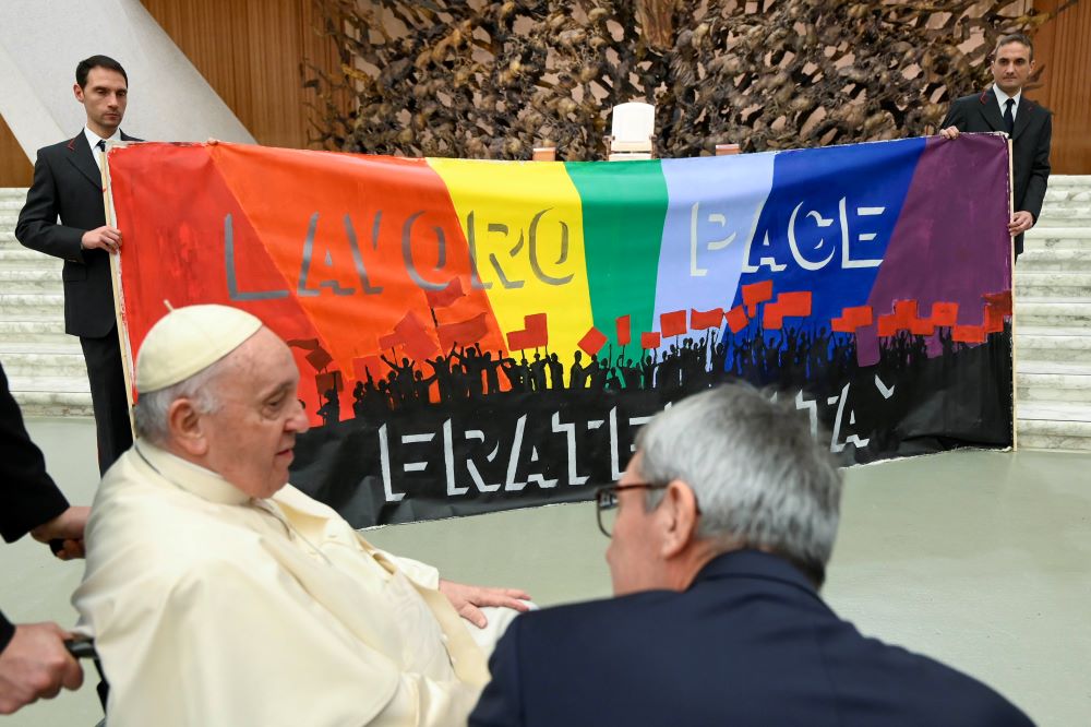 Pope Francis meets members of CGIL, Italy's largest labor union. A in Italian says, "Work, Peace, Fraternity." Pope Francis meets members of CGIL, Italy's largest labor union. A in Italian says, "Work, Peace, Fraternity."
