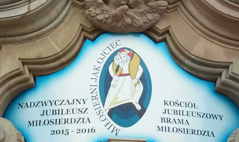 Holy Year of Mercy (2015-2016) logo by Marko Rupnik. Logo with text and icon framed by stone carving.