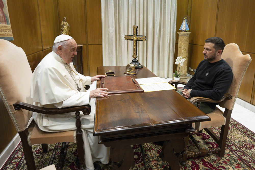 Pope Francis and President Zelenskyy, Vatican City, 2023. Pope Francis and President Zelenskyy sit across from each other at Pope's desk.
