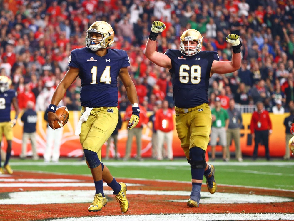 Notre Dame football players at the Fiesta Bowl, Glendale, Ariz. 2016. Two players on field.