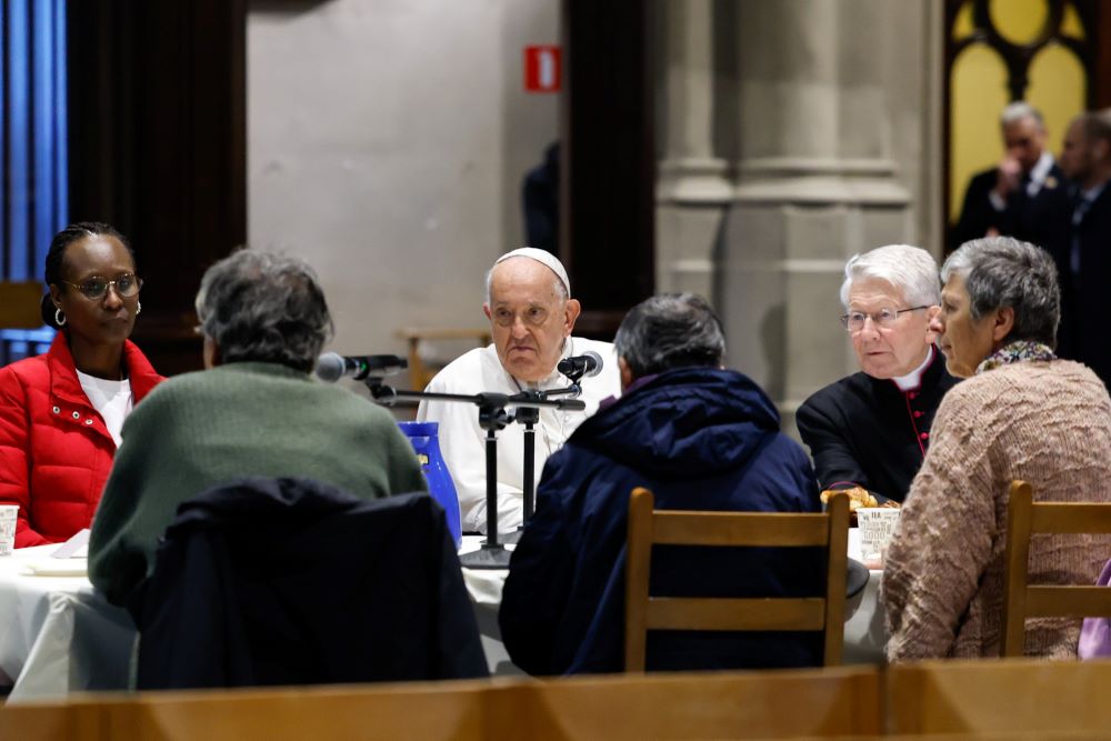 Pope Francis has breakfast with migrants and people who are unhoused in the Church of St. Gilles in Brussels Sept. 28. Pope Francis has breakfast with migrants and people who are unhoused in the Church of St. Gilles in Brussels Sept. 28.