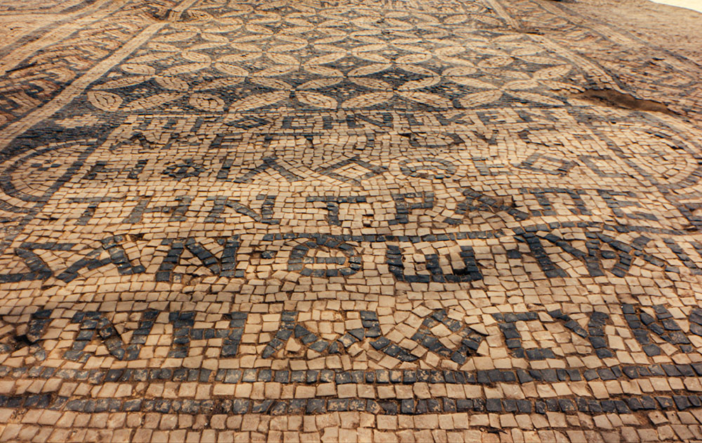 The Akeptous inscription that adorns the Megiddo Mosaic, currently on exhibit at the Museum of the Bible, reads, "The God-loving Akeptous has offered the table to God Jesus Christ as a memorial." (Museum of the Bible)
