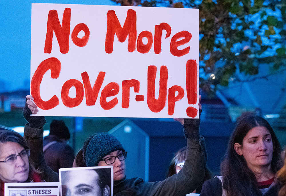 Suzanne Emerson, from Silver Spring, Maryland, holds a sign during a Nov. 12, 2018, news conference held by Survivors Network of those Abused by Priests as the U.S. Conference of Catholic Bishops met in Baltimore for the annual fall general assembly. The growing abuse crisis facing the U.S. church in 2018 topped the meeting agenda. (CNS/Catholic Review/Kevin J. Parks)