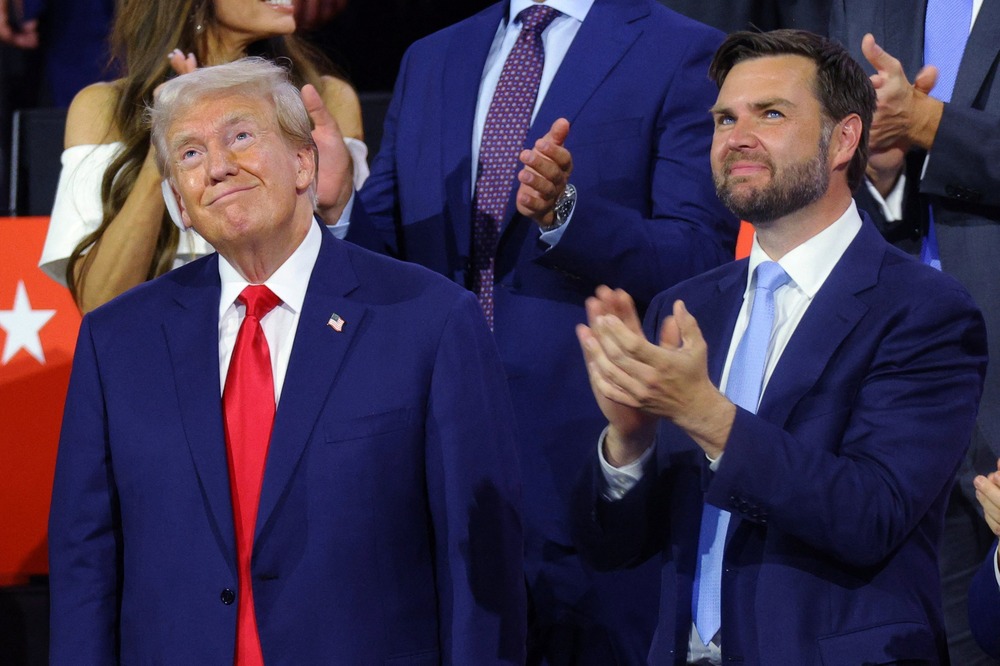 Trump and Vance at Republican National Convention, Milwaukee, July 15, 2024. Trump and Vance stand looking up and smiling.