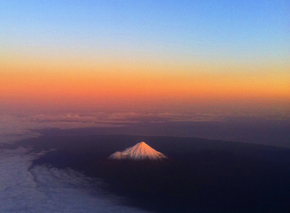Mount Taranaki, New Zealand, June 12, 2011. Aerial view of mountain in sunset.