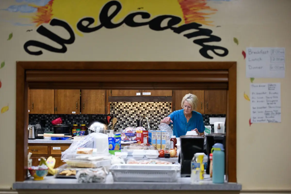 A volunteer packs lunches October 4, 2024, at Clyde First Baptist Church in Clyde, North Carolina.