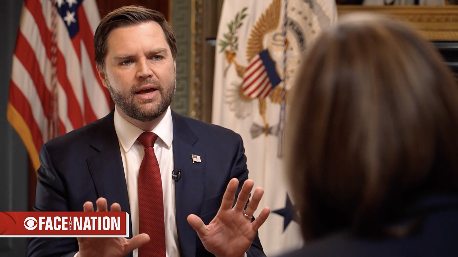 Vice President J.D Vance, "Face the Nation," Jan. 2025. Vance wears blue suit and red tie, holds hand up in gesture while speaking.
