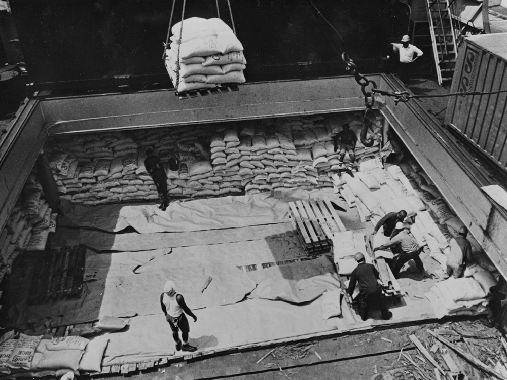 Workers in Philadelphia load a shipment of rice bound for Bangladesh in summer 1976, in a relief effort handled by Catholic Relief Services, using funds from the first national Operation Rice Bowl campaign. (CNS/Bob Strawn)