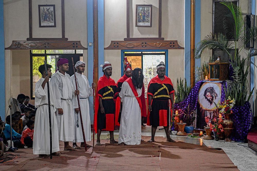 Jesus is brought before Pontius Pilate for judgment during the Way of the Cross reenactment. (Piyas Biswas)