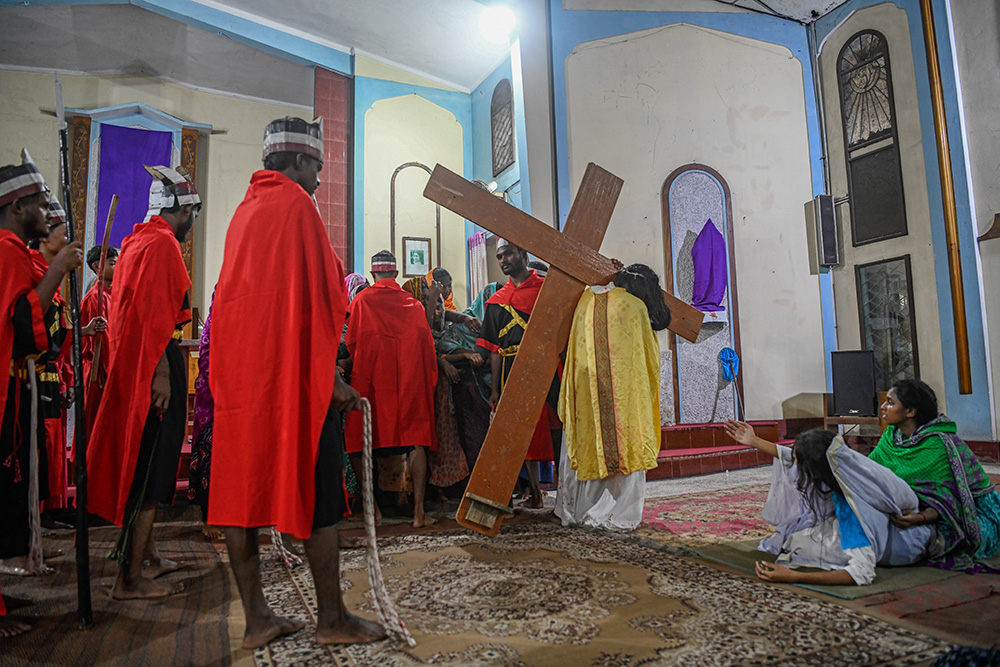 Jesus meets his mother, Mary, during the Way of the Cross reenactment. (Piyas Biswas)