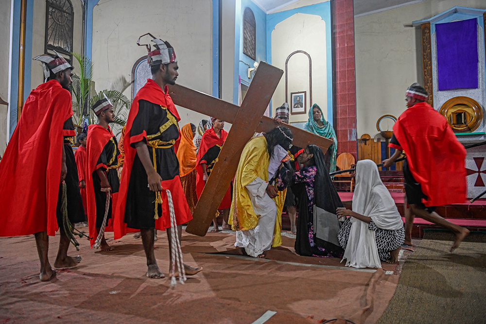 Veronica wipes Jesus' face during the Way of the Cross. (Piyas Biswas)