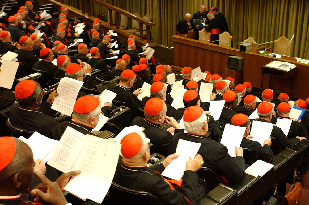 Cardinals gather in the Vatican's synod hall April 7, 2005, a day before the funeral of Pope John Paul II. (CNS/L'Osservatore Romano)