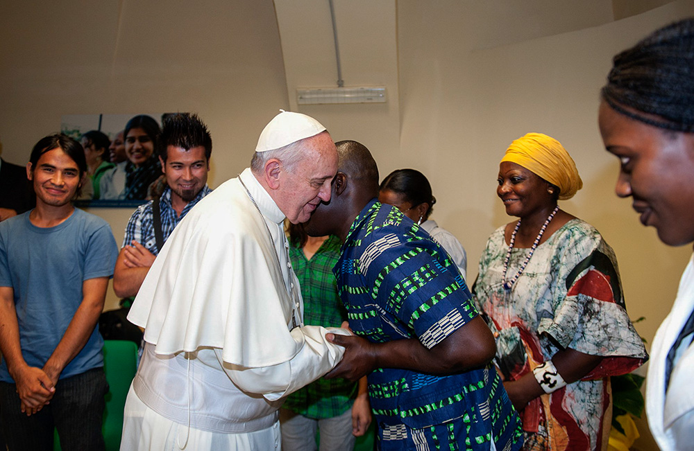 Pope Francis greets refugees during a visit to the Astalli Center of the Jesuit Refugee Service in Rome Sept. 10, 2013. (CNS/Catholic Press Photo/Alessia Giuliani)