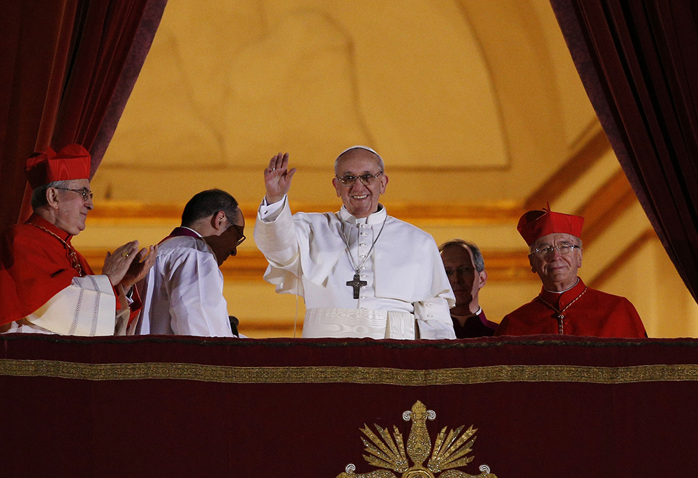 Pope Francis waves from the central balcony of St. Peter's Basilica following his election March 13, 2013. Pope Francis died April 21. (CNS/Paul Haring)