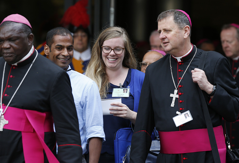 Bishops and youth delegates leave a session of the Synod of Bishops on young people, the faith and vocational discernment at the Vatican on Oct 5, 2018. (CNS/Paul Haring)