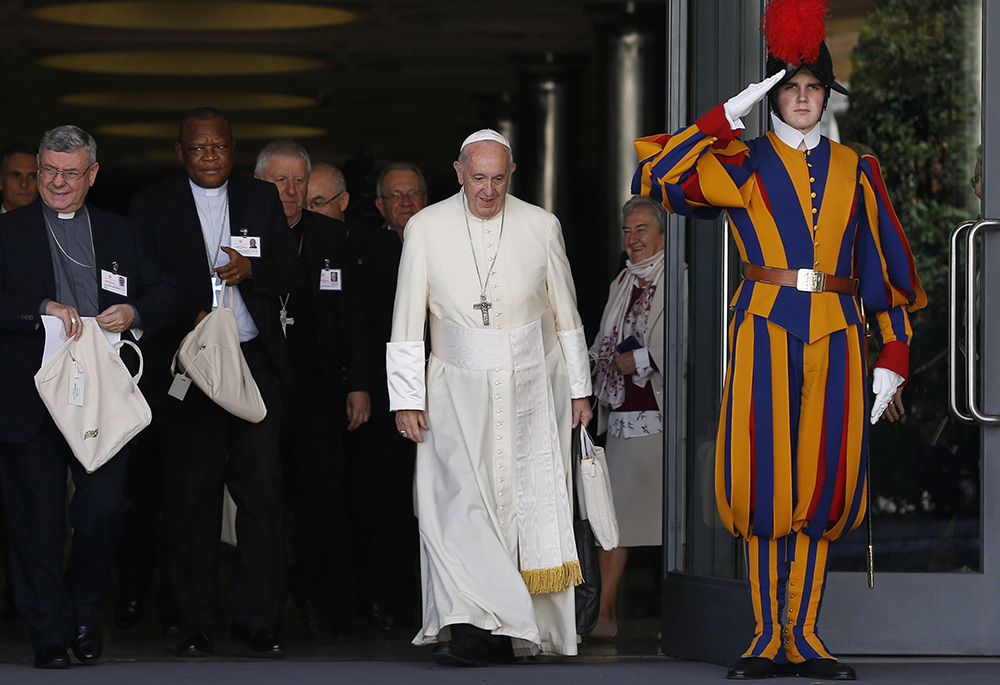 Pope Francis and bishops leave the morning session of the Synod of Bishops for the Amazon at the Vatican on Oct. 8, 2019. (CNS/Paul Haring)