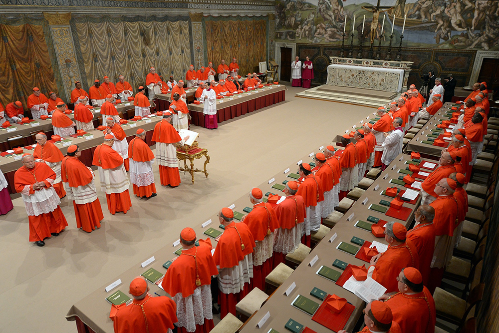 Cardinals enter the Sistine Chapel at the Vatican March 12, 2013, to elect a successor to Pope Benedict XVI. (CNS/Vatican Media)