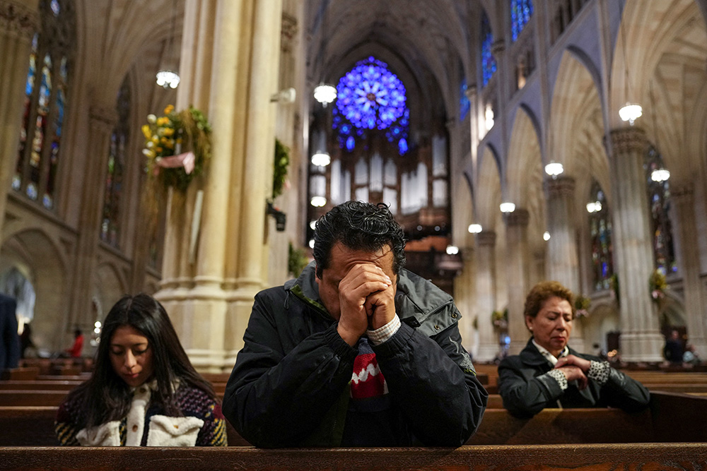 A man prays at St. Patrick's Cathedral in New York City April 21, 2025, after the death of Pope Francis was announced by the Vatican. Pope Francis, formerly Argentine Cardinal Jorge Mario Bergoglio, died April 21 at age 88. (OSV News/Reuters/Adam Gray)