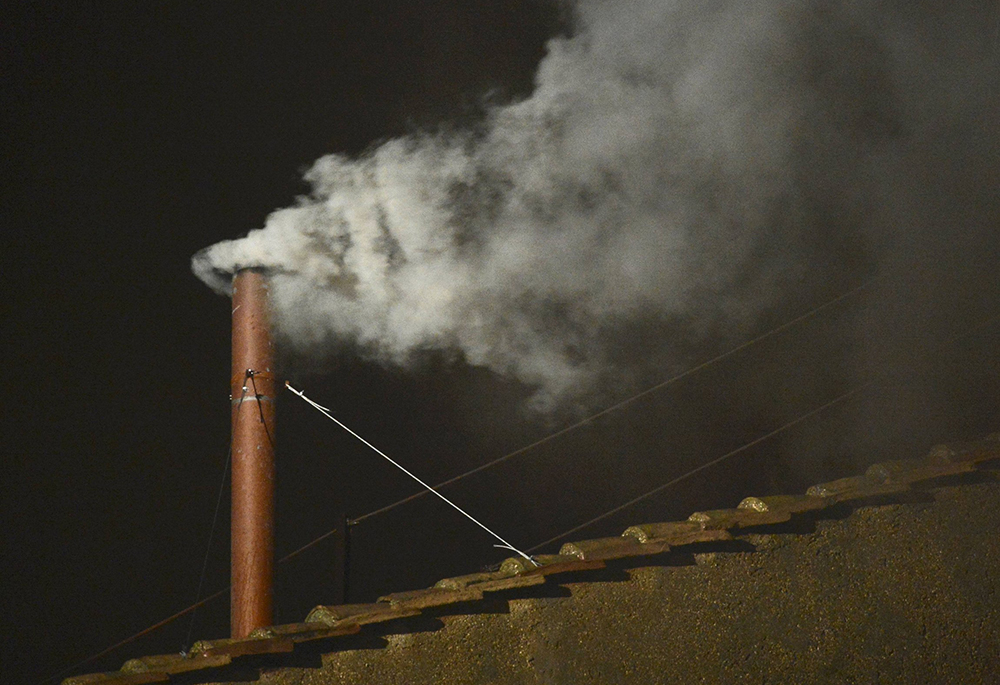 White smoke rises from the chimney above the Sistine Chapel in the Vatican, indicating a new pope has been elected, March 13, 2013. When The world's Catholic cardinals enter the Sistine Chapel to elect the next pontiff, eight out of ten share the distinction that they were elevated to their rank by Pope Francis. (CNS/Reuters/Dylan Martinez)