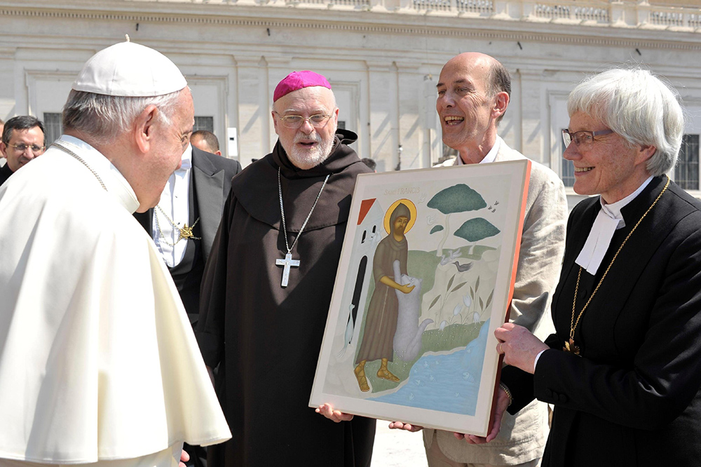Cardinal Anders Arborelius of Stockholm and Lutheran Archbishop Antje Jackelen of Uppsala, primate of the Church of Sweden, present Pope Francis with an icon of St. Francis of Assisi following the pope's general audience June 14, 2017, at the Vatican. The artist, Lars Gerdmar, held the icon during the presentation of the gift, which was an expression of gratitude for Pope Francis' visit to Sweden in October 2016. (CNS/L'Osservatore Romano)