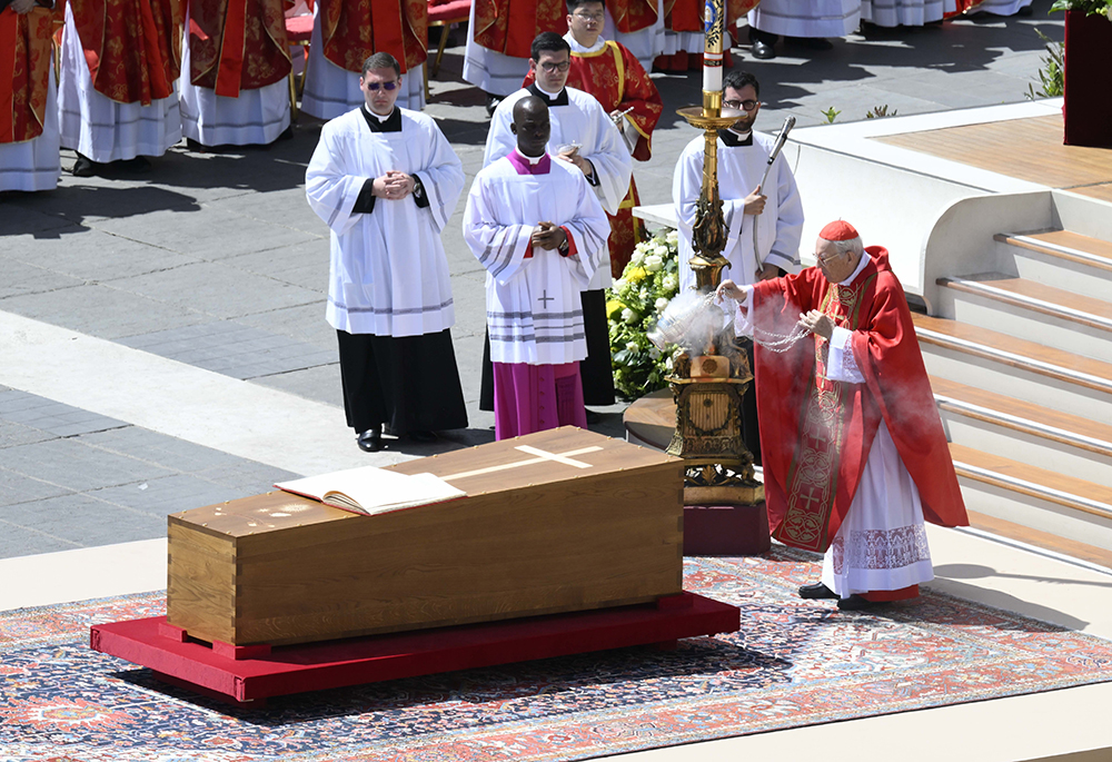 Cardinal Giovanni Battista Re, dean of the College of Cardinals, blesses the coffin as he leads the funeral Mass of Pope Francis in St. Peter's Square at the Vatican on April 26, 2025. (OSV News/Vatican Media)
