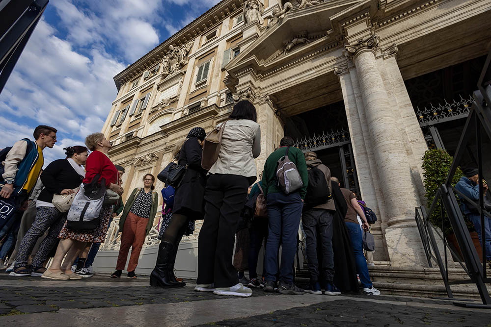 The faithful stand in line in front of Rome's Basilica of St. Mary Major early April 27, 2025, to pray at Pope Francis' tomb. (CNS/Pablo Esparza)