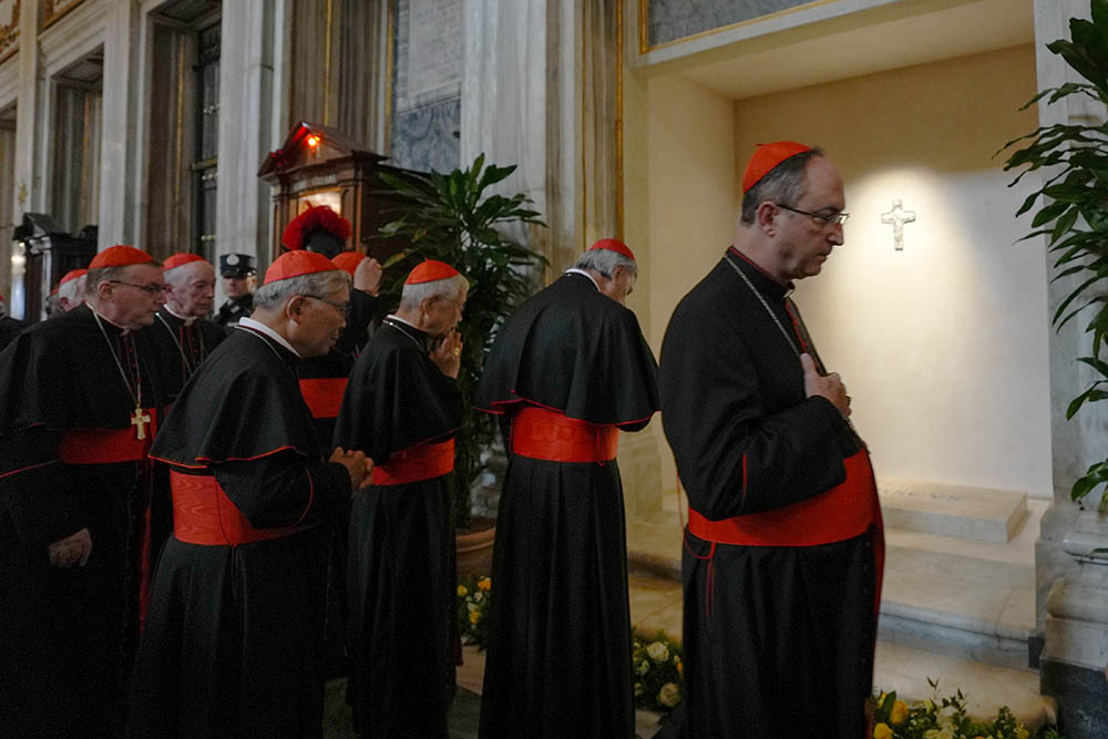 Members of the College of Cardinals pray at the tomb of Pope Francis and attend vespers at the Basilica of St. Mary Major in Rome April 27, 2025. Cardinals and the faithful visited the Marian basilica to offer their prayers and respects. (CNS/Lola Gomez)