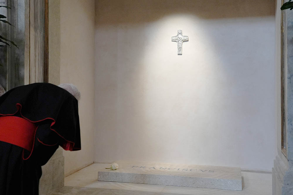 A member of the College of Cardinals prays at the tomb of Pope Francis and attends vespers at the Basilica of St. Mary Major in Rome April 27, 2025. Cardinals and the faithful visited the Marian basilica to offer their prayers and respects. (CNS/Lola Gomez)