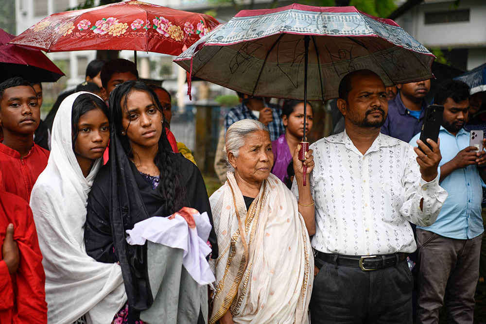 An elderly woman attends the Way of the Cross. (Piyas Biswas)