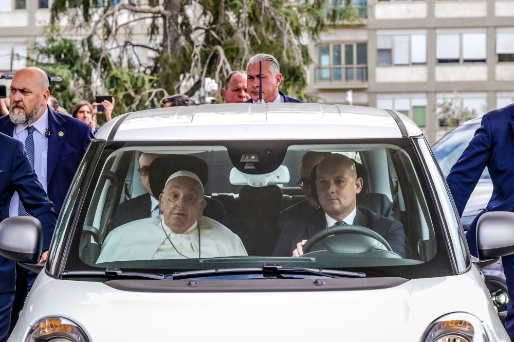 Francis in front seat of car