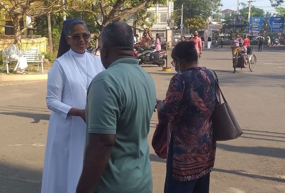 Nun collects donations.