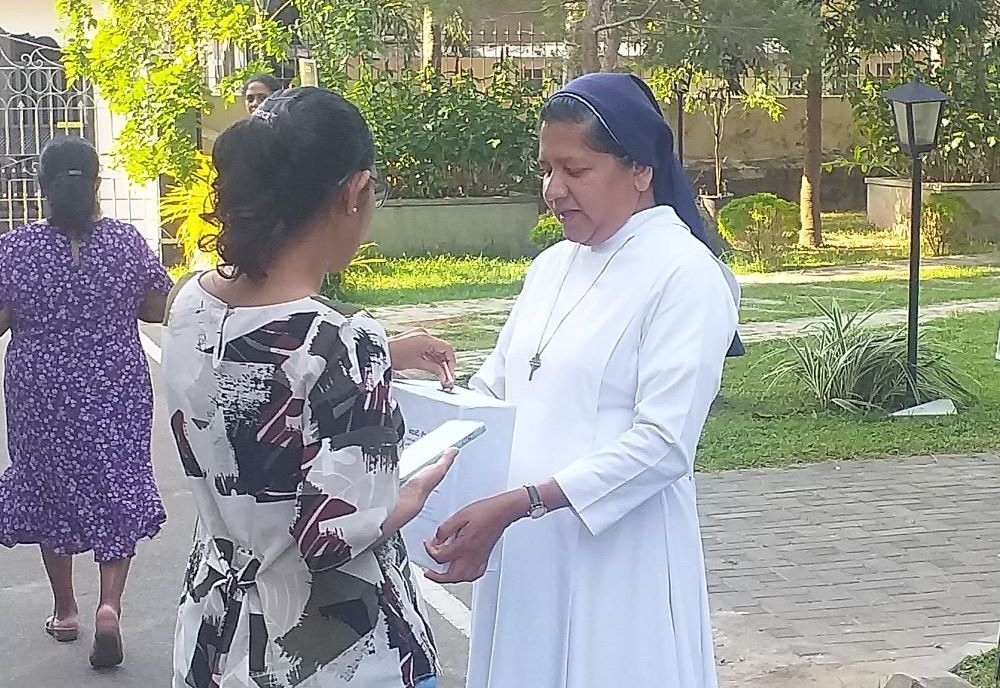 nun collects donations.