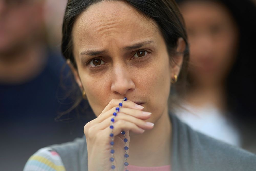 woman with rosary woman with rosary