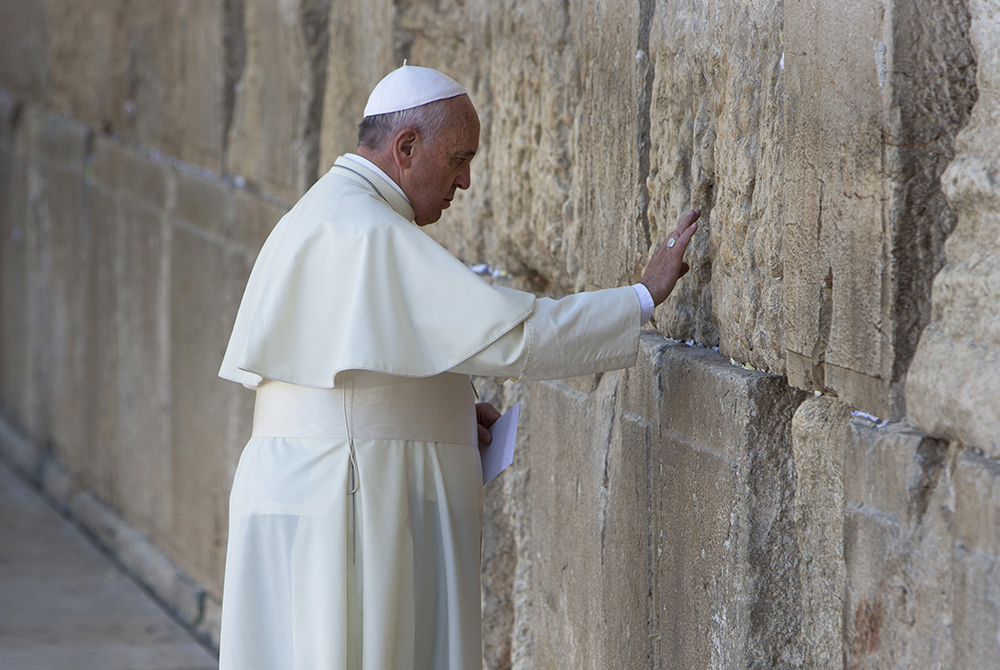 Pope Francis prays in front of the Western Wall, in Jerusalem's Old City May 26, 2014. (AP Photo/Oded Balilty, File)
