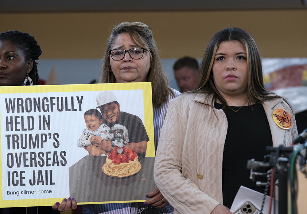 Jennifer Vasquez Sura, the wife of Kilmar Abrego Garcia of Maryland, who was mistakenly deported to El Salvador, right, stands with supporters during a news conference April 4 at CASA's Multicultural Center in Hyattsville, Maryland. (AP photo/Jose Luis Magana)
