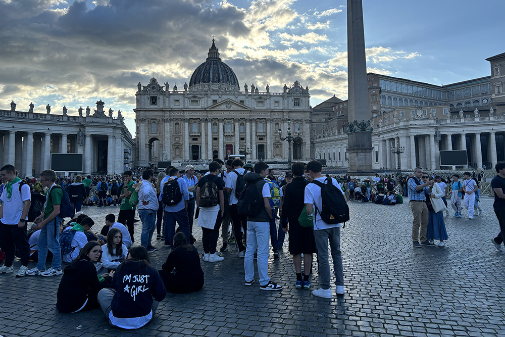 Youth gather in St. Peter's Square the evening of April 26, hours after hundreds of thousands of Catholics, leaders and diplomats crammed into St. Peter's Square to mourn the death of Pope Francis. (NCR photo/Olivia Bardo)