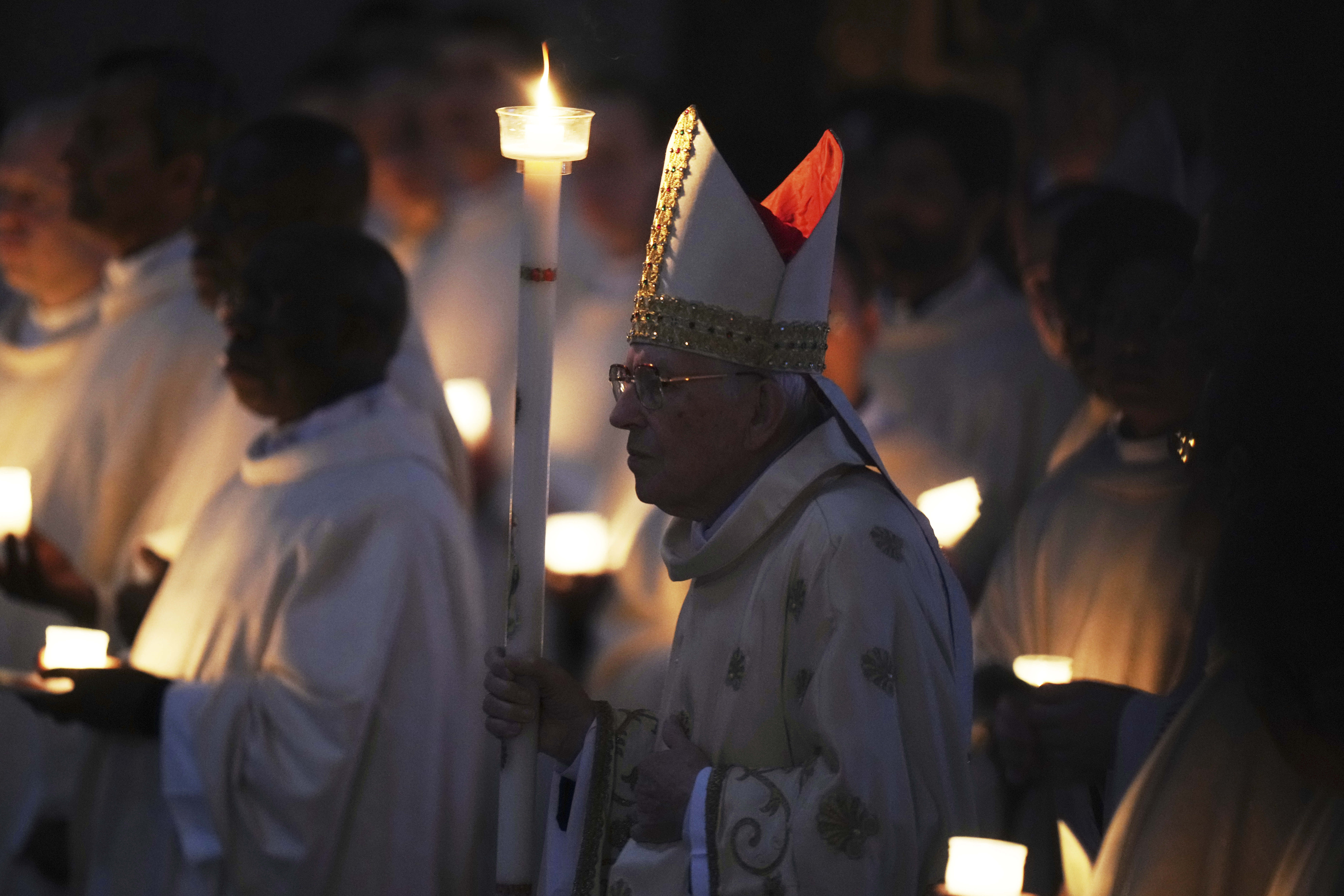 Dean of the College of Cardinals Giovanni Battista Re leads the Easter vigil inside St. Peter's Basilica at the Vatican Dean of the College of Cardinals Giovanni Battista Re leads the Easter vigil inside St. Peter's Basilica at the Vatican, Saturday, April 19, 2025. (AP Photo/Alessandra Tarantino)