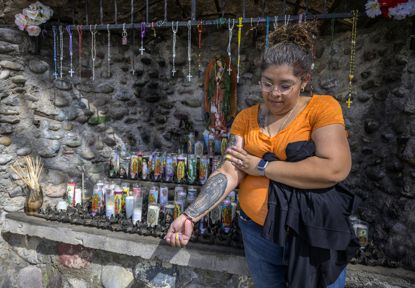 Roxanne Castillo of Albuquerque proudly displays her Virgen the Guadalupe tattoo after praying at an altar near El Santuario De Chimayo in Northern New Mexico on Good Friday, April 18, 2025. Chimayo, N.M. (AP Photo/Roberto E. Rosales) Roxanne Castillo of Albuquerque proudly displays her Virgen the Guadalupe tattoo after praying at an altar near El Santuario De Chimayo in Northern New Mexico on Good Friday, April 18, 2025. Chimayo, N.M.