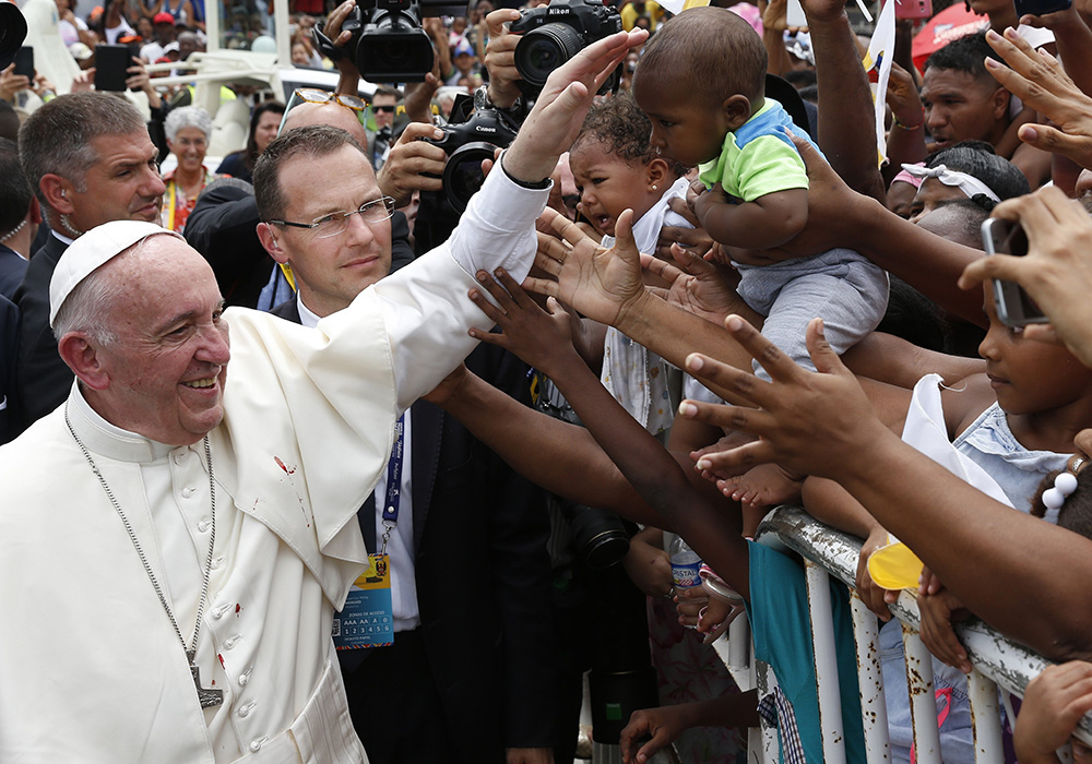 Pope Francis greets people near the Talitha Qum homeless shelter in Cartagena, Colombia, on Sept. 10, 2017. Pope Francis, formerly Argentine Cardinal Jorge Mario Bergoglio, died April 21, 2025, at age 88. (CNS/Paul Haring)