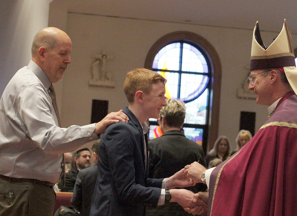 Bishop Shawn McKnight of Jefferson City, Mo., greets catechumens during the Rite of Election at Our Lady of Lourdes Church in Columbia on the first Sunday of Lent, Feb. 26, 2023. (OSV News/The Catholic Missourian/Jay Nies)
