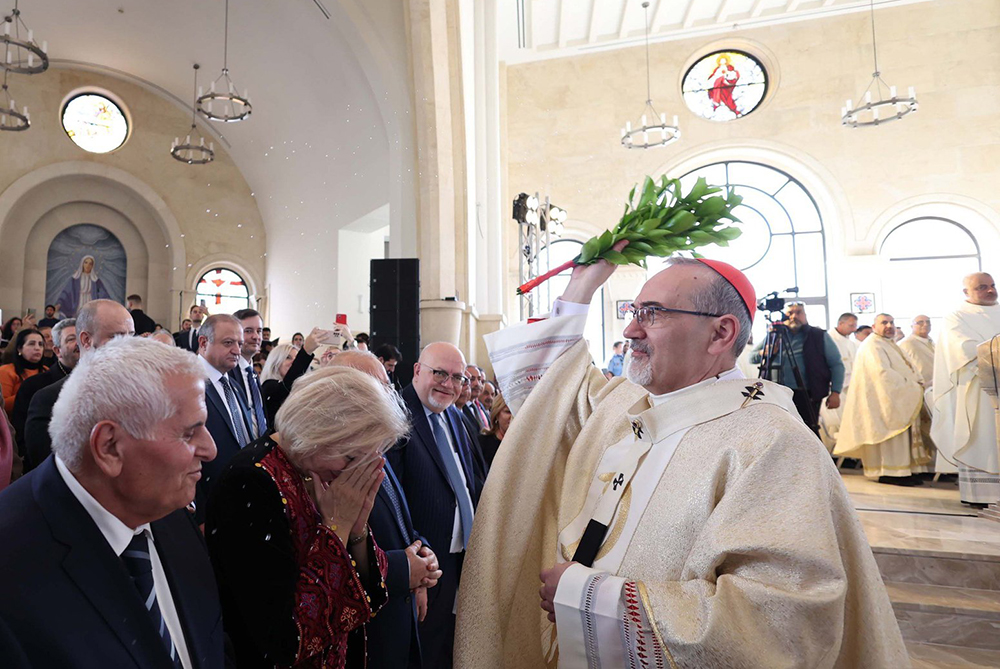 Cardinal Pierbattista Pizzaballa, Latin patriarch of Jerusalem, blesses participants with holy water at the Church of the Baptism of the Lord at Al-Mughtas, Jordan, Jan. 10, 2025, during the consecration and inauguration of the church in the presence of papal representative, Cardinal Pietro Parolin, Vatican's secretary of state. (OSV News/Courtesy of Latin Patriarchate of Jerusalem)